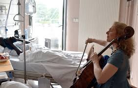 Cellist playing for patient